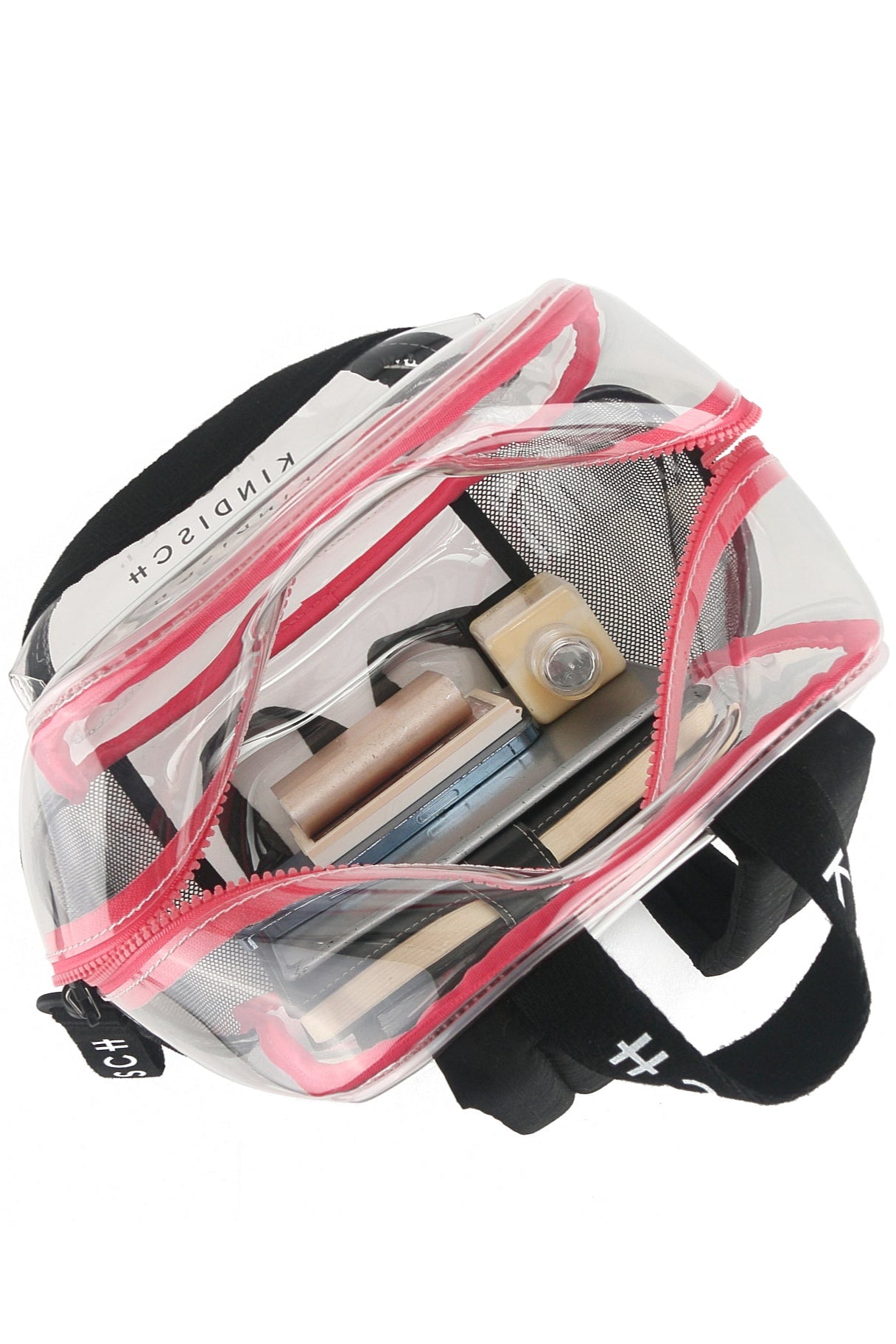 The KINDISCH Kids Backpack - Pink by kindischworld.com features pink trim, a black handle, and an outer pocket. Shown partially open, it reveals storage space for items like brushes, a mascara, and makeup containers.