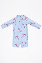 The Baby Badeanzug - PARROT from kindischworld.com is a light blue, long-sleeved infant romper with back zipper and flying bird pattern—perfect UV-Badebekleidung with UPF50+ for sun protection.